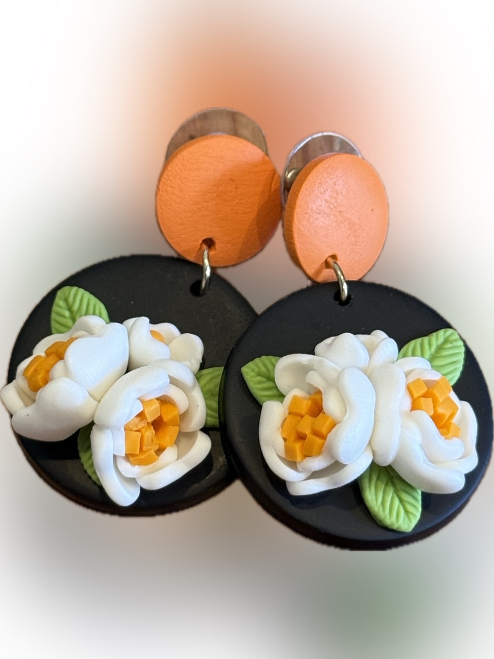 Handcrafted Black Floral Drop Clay Earrings with Orange Studs